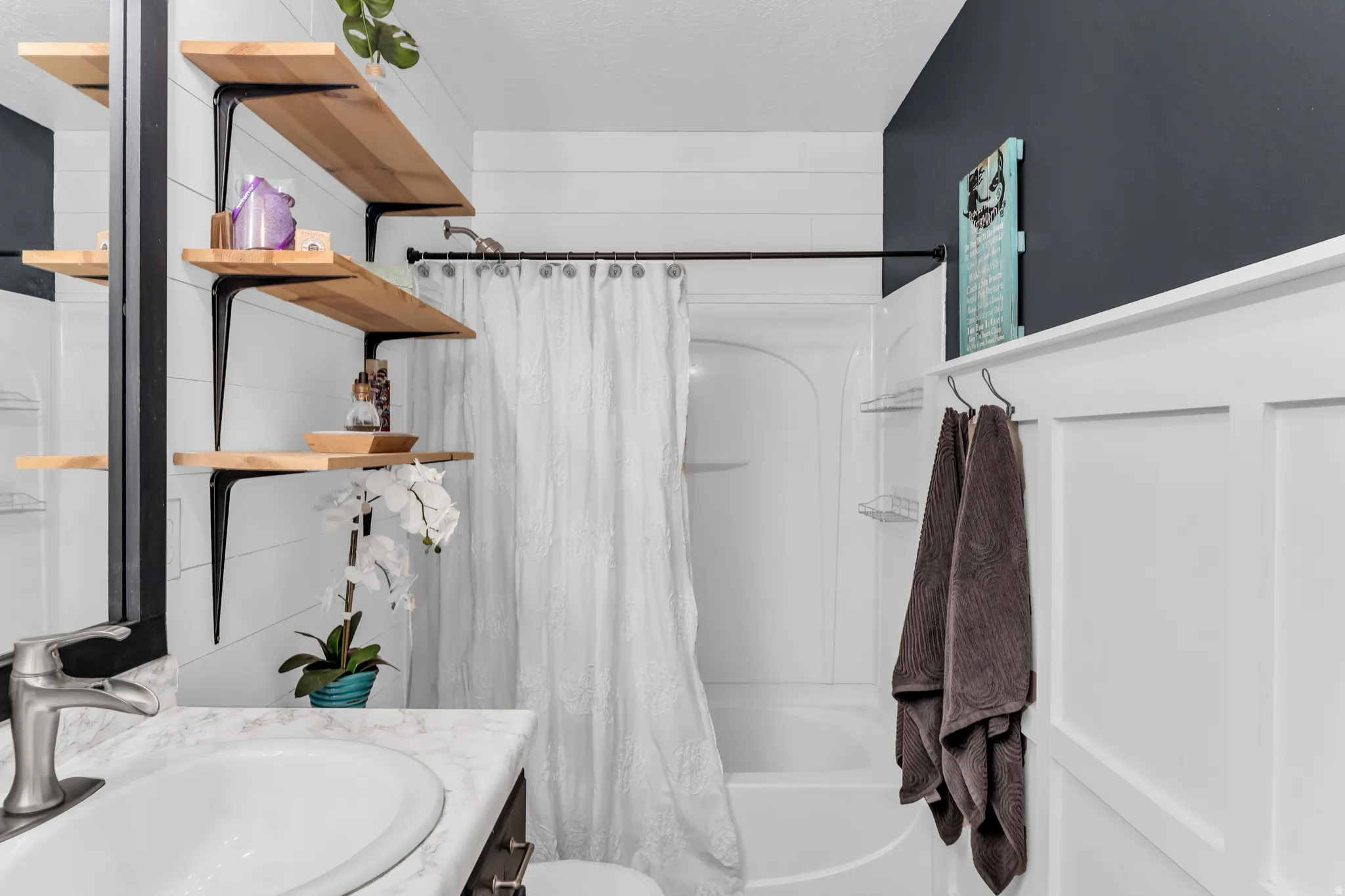 Vanity with integrated sink and chrome-finish faucet