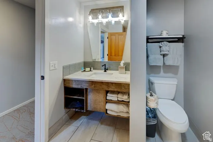 Floating wood-finish vanity with an integrated sink and countertop