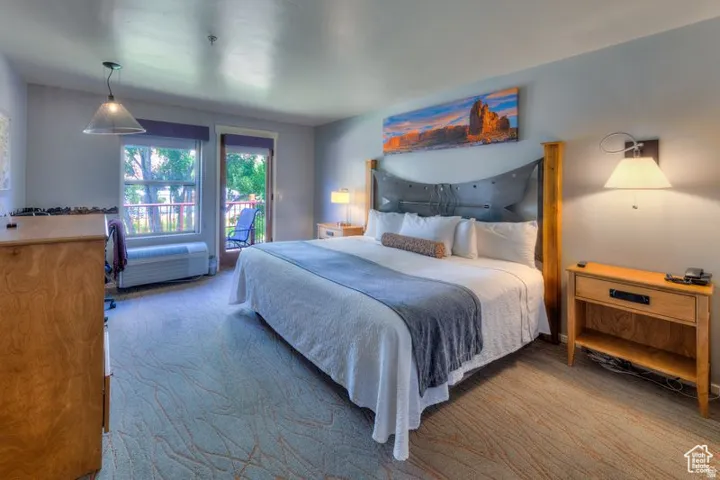 Spacious room featuring patterned carpet flooring and light-toned walls