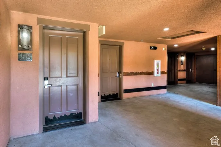 Panel door with digital lock and wall-mounted sconce