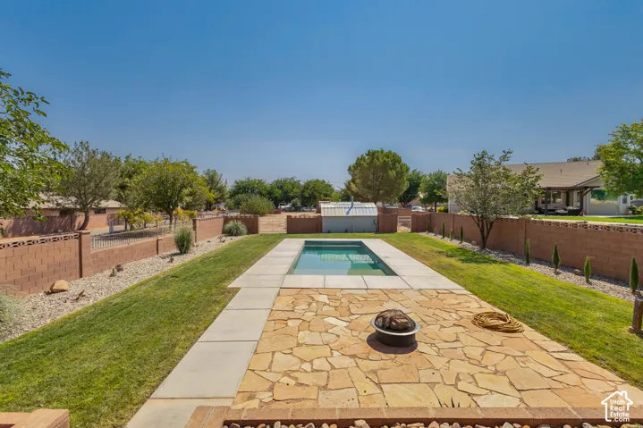 Rectangular swimming pool with surrounding concrete coping