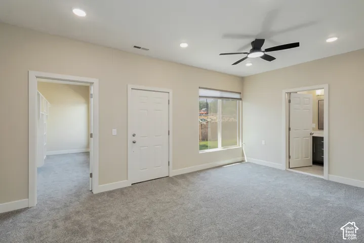 Recessed lighting, ceiling fan, carpet flooring, and window with roller shade