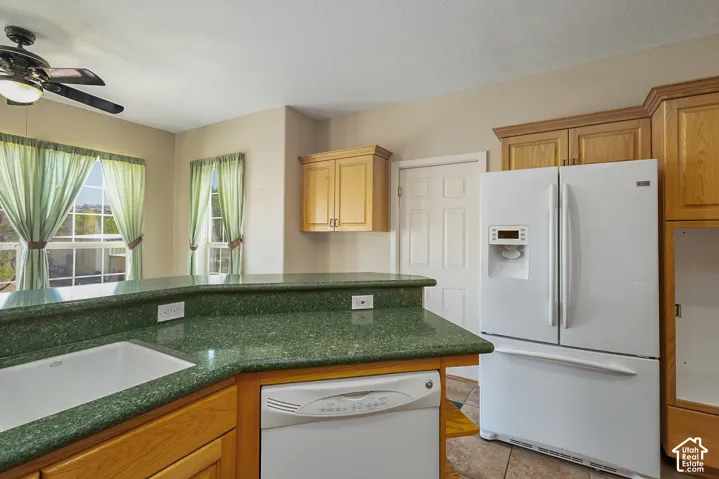 Green speckled countertop with a built-in sink