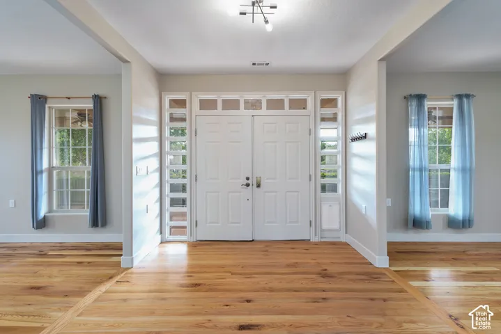 Double-panel entry door with transom window and sidelights