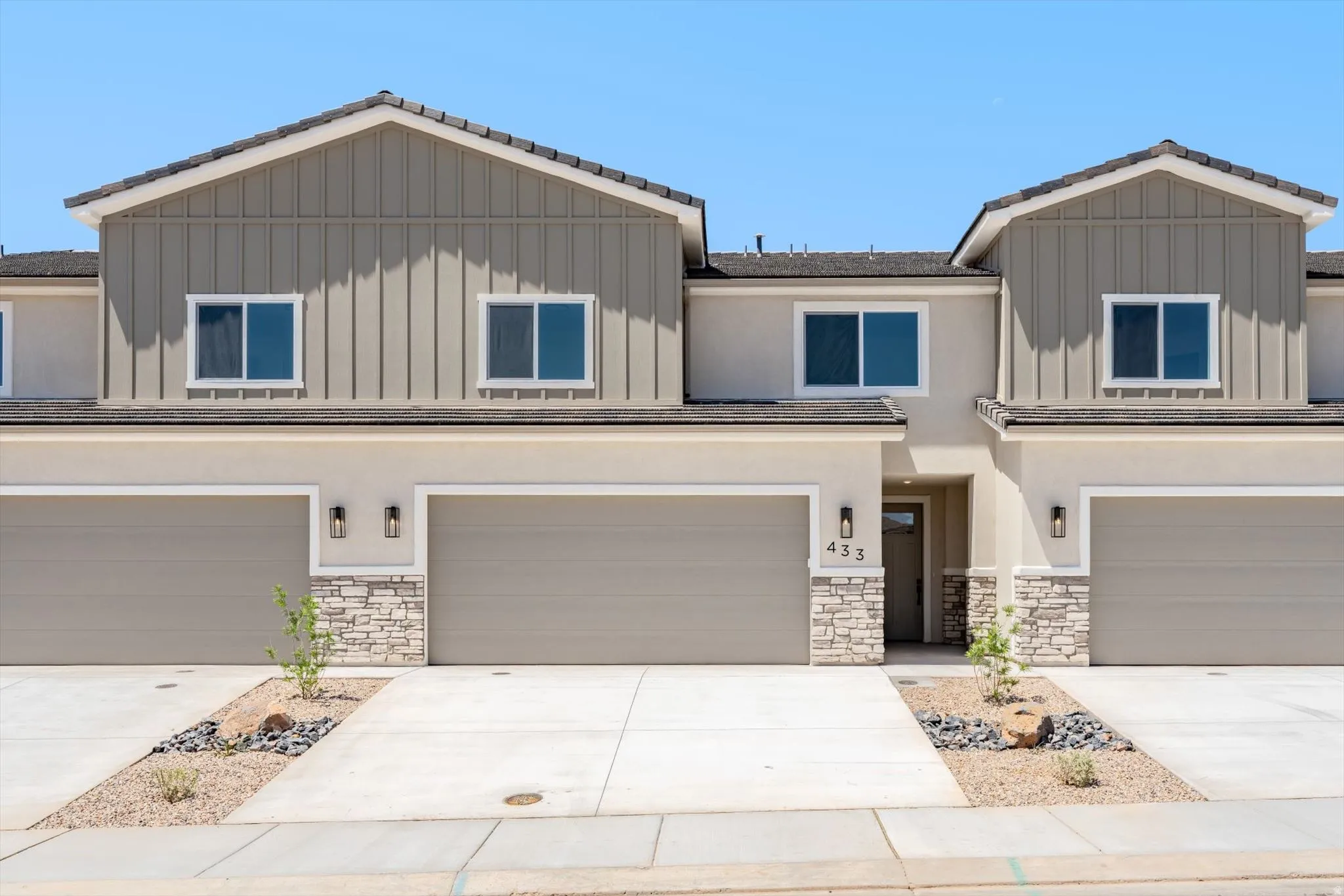 Contemporary exterior with stucco and board-and-batten siding