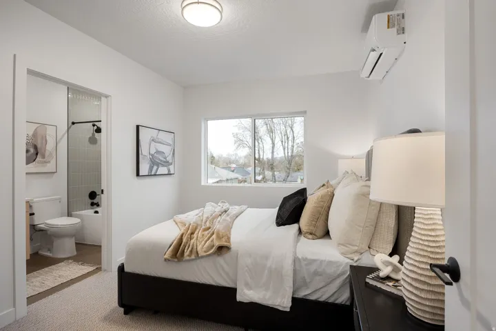 Recessed lighting, window with exterior scenery, and a built-in split air conditioning unit