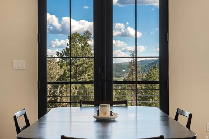 Black framed glass doors so you can view the pines while you dine.