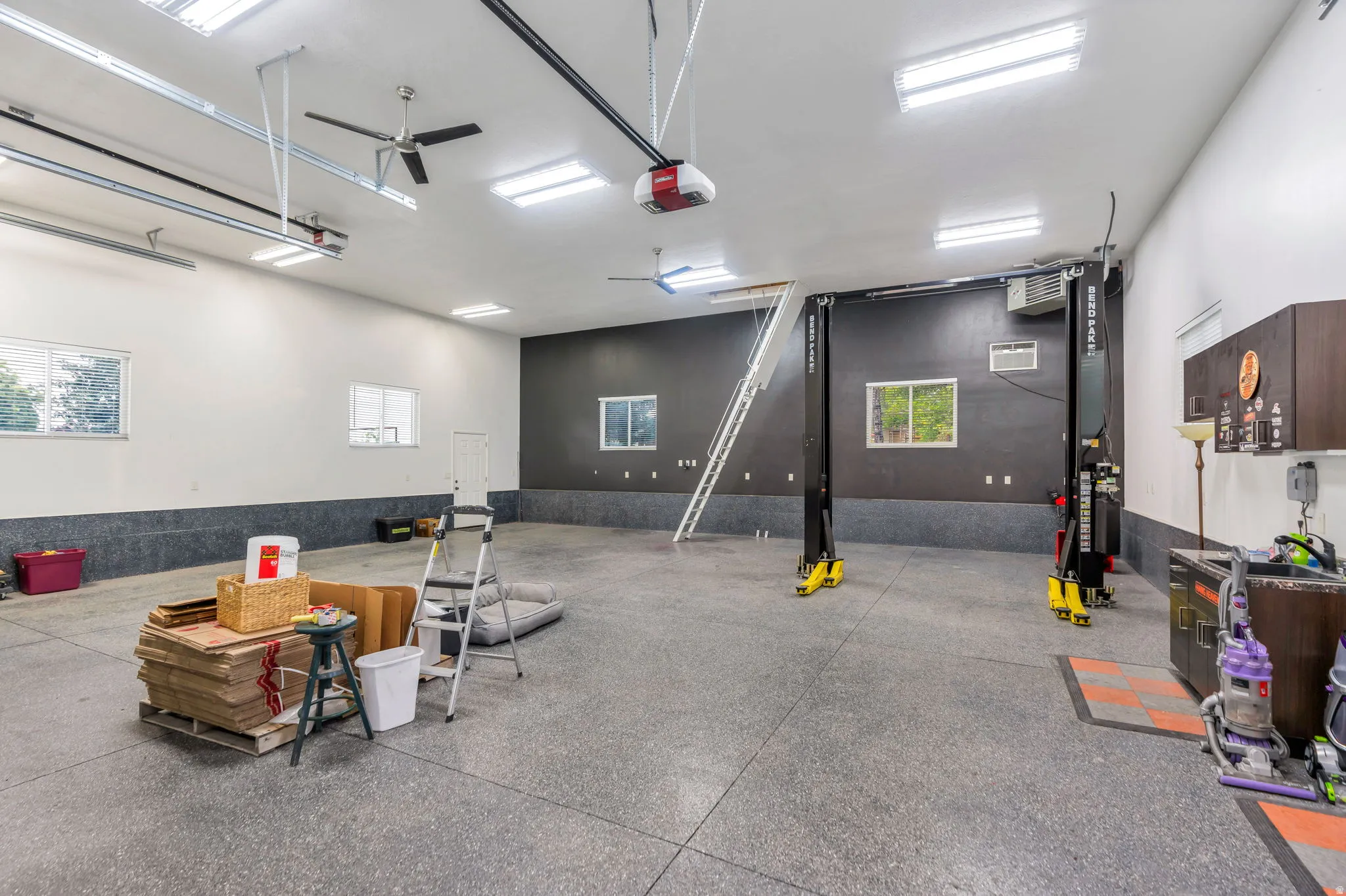 Rare detached garage offers tremendous flexibility for car enthusiasts, with 10,000 lb. car lift included!