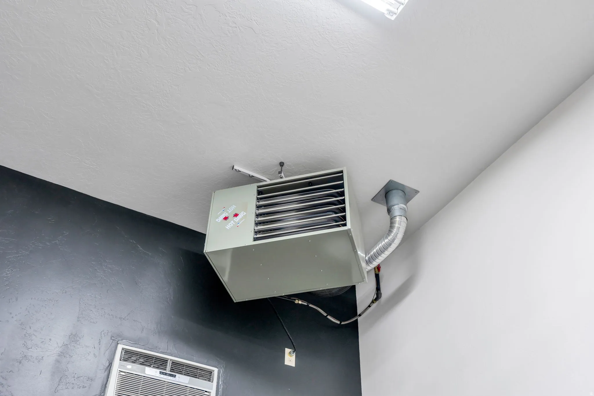 The detached garage is heated for comfort while working.