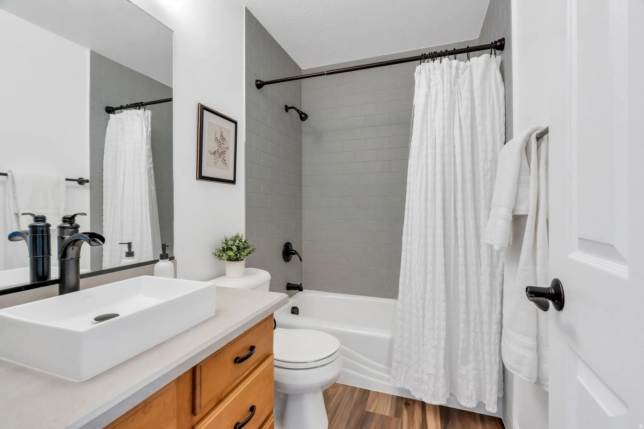 A second full bathroom upstairs provides exceptional convenience for family and guests.