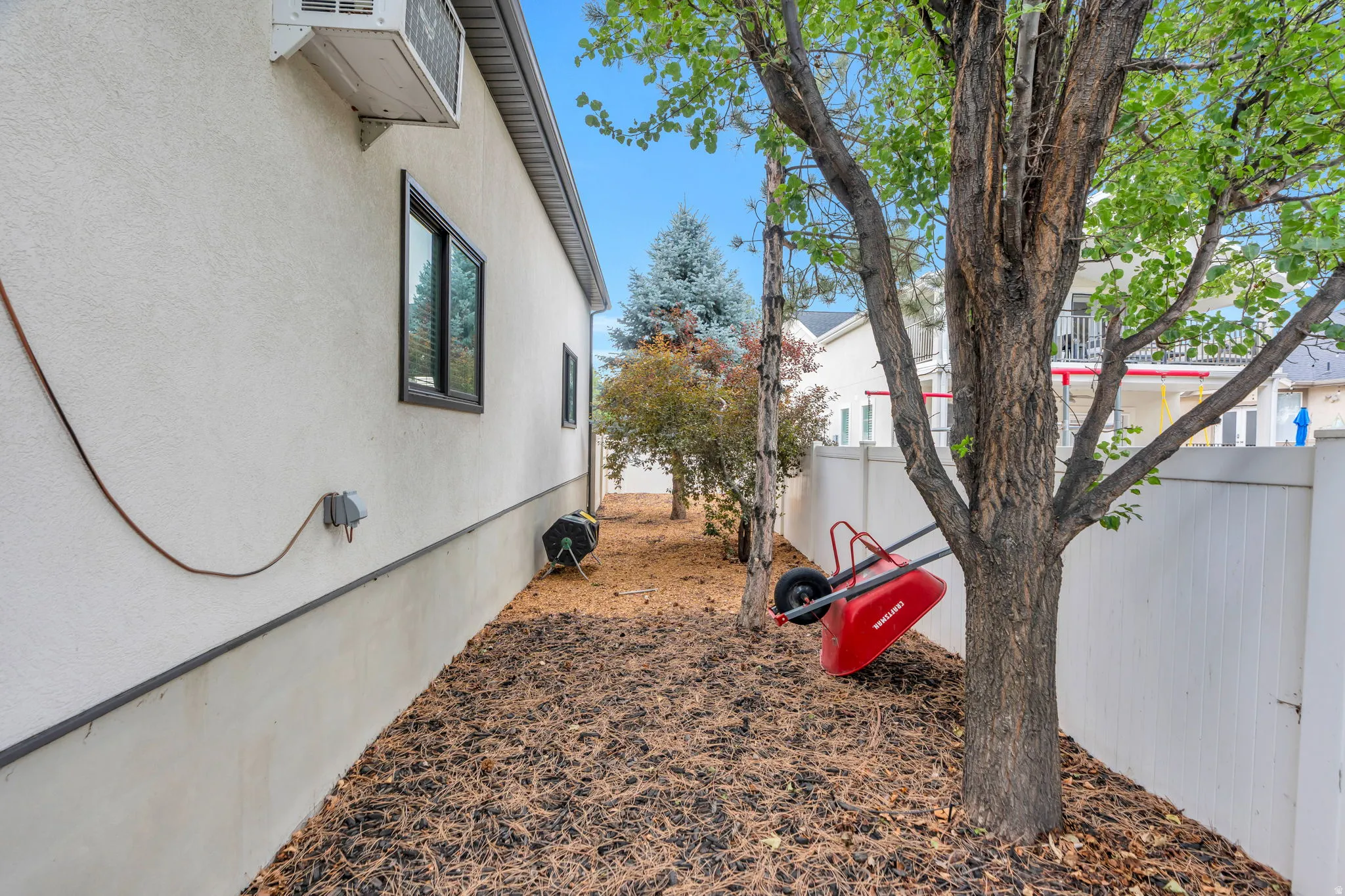 Behind the detached garage is space to store yard equipment, or to make a handy dog run.
