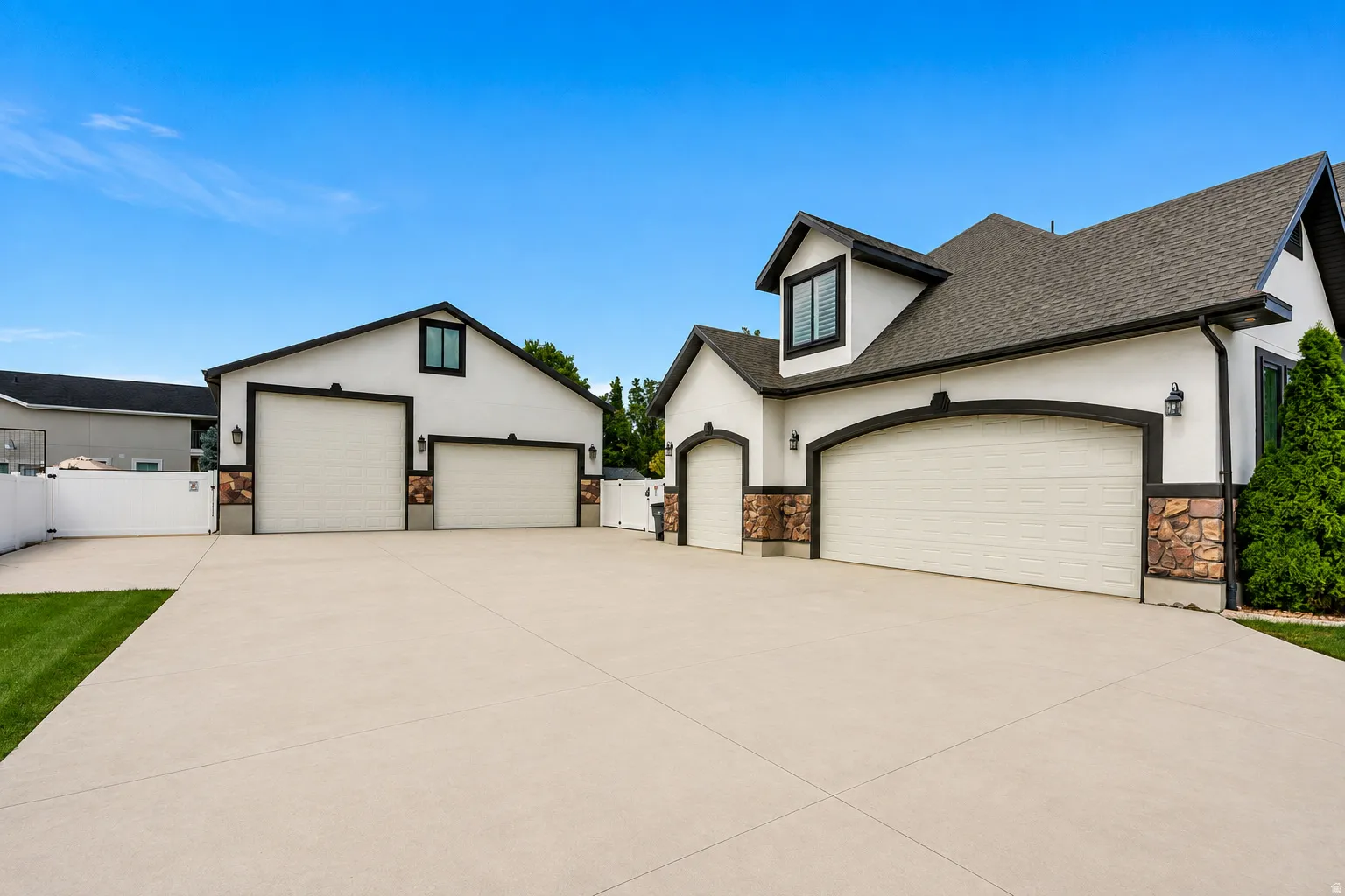 A dream setup for business owners, car collectors and serious hobbyists—with incredible garage space and an expansive driveway offering room for vehicles, trailers, equipment and projects.