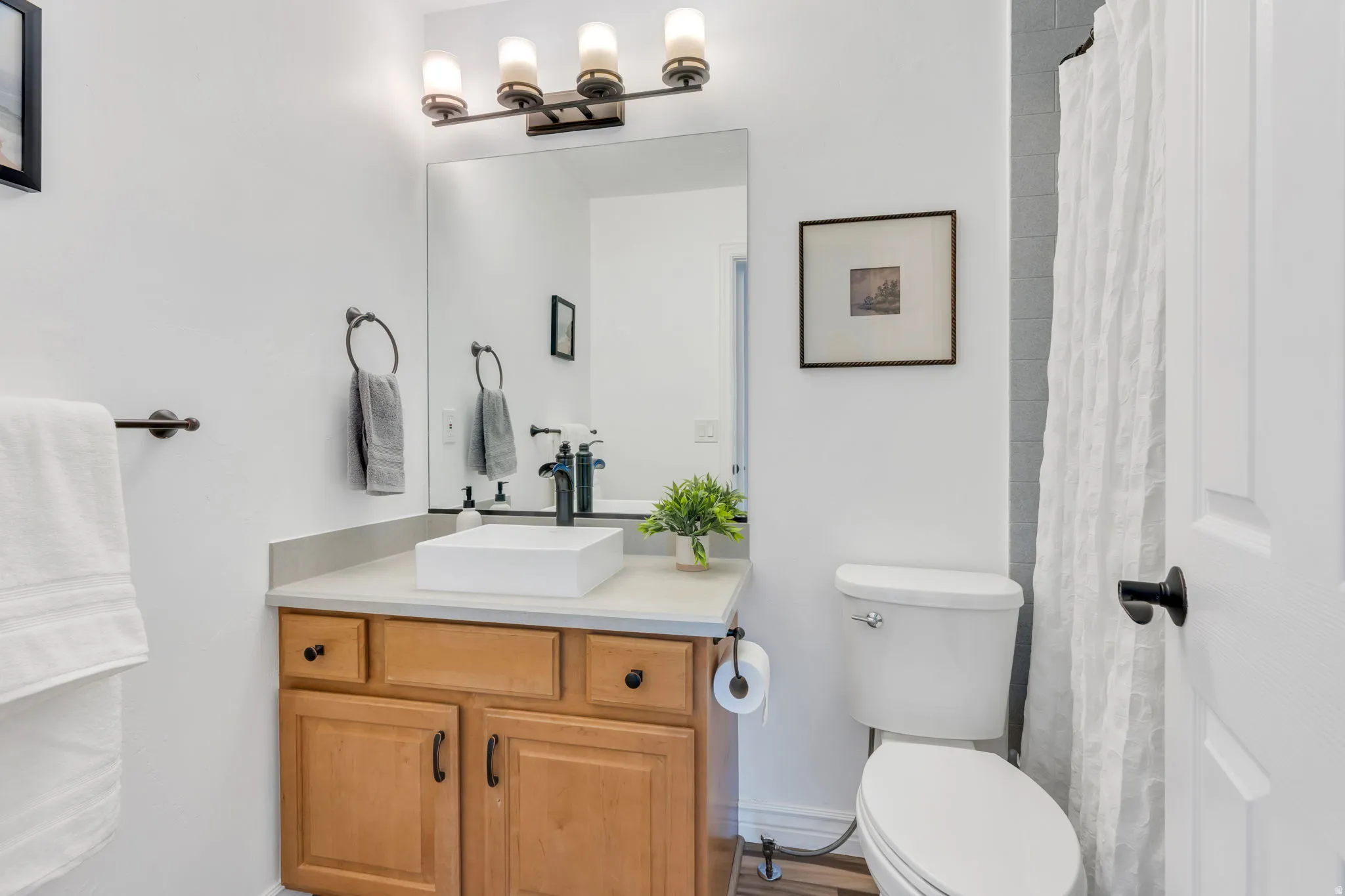 The spacious bedroom above the garage enjoys its own full bathroom, creating a private suite that's ideal for guests, family, or extended stays.