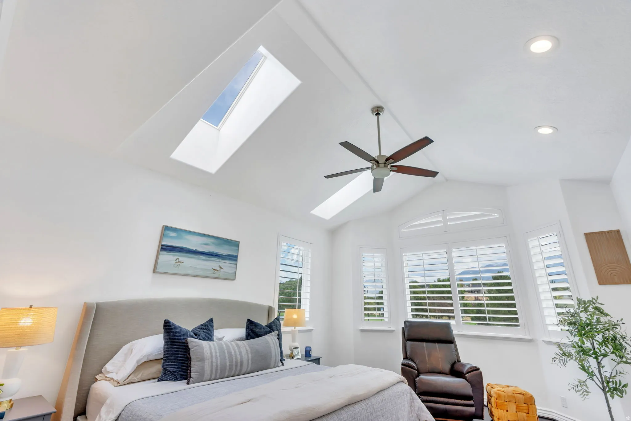 Vaulted ceiling with skylight and recessed lighting