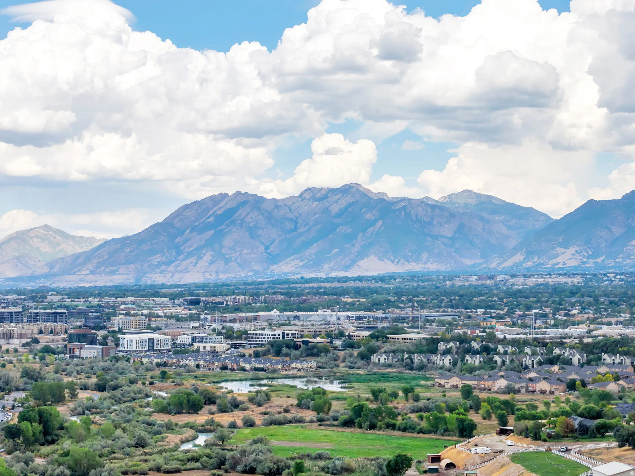 Expansive aerial views highlight the best of Utah living, where beautiful neighborhoods and abundant recreation meet a dramatic mountain backdrop.