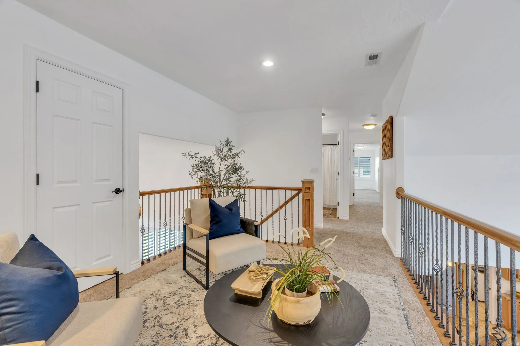 A charming upstairs nook adds flexible living space, perfect for bookshelves, a cozy sitting area, or a peaceful place to unwind.