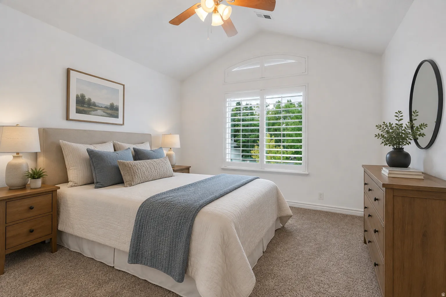 Plantation shutters and abundant natural light add to the appeal of this comfortable 3rd bedroom upstairs.  Virtually staged to illustrate one possible furniture arrangement and use of the space.