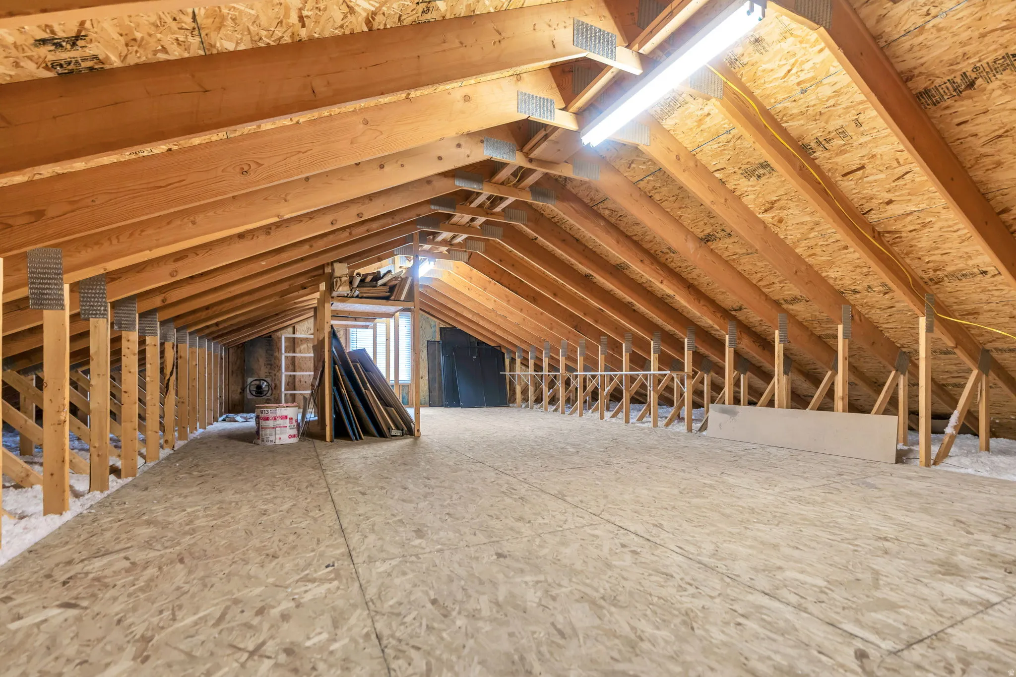 The expansive attic over the detached garage with built-in ladder provides easy access to store all your gear, toys, or equipment.