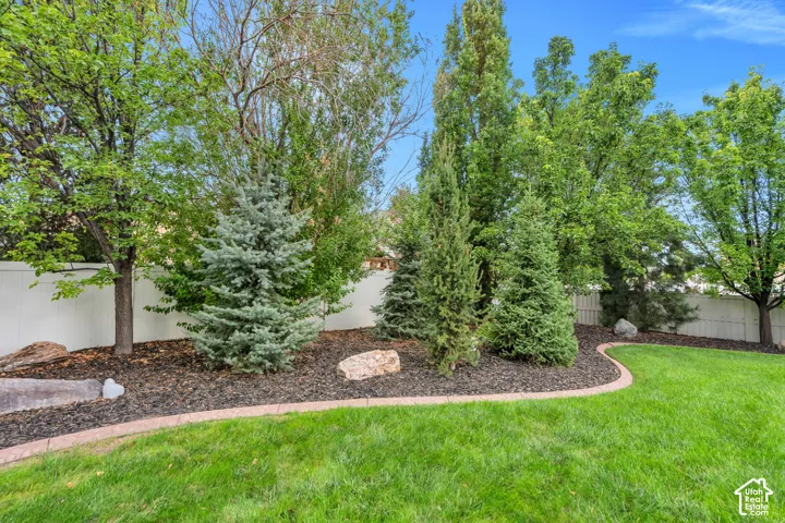 Mature trees and established landscaping create a comfortable and private outdoor setting.