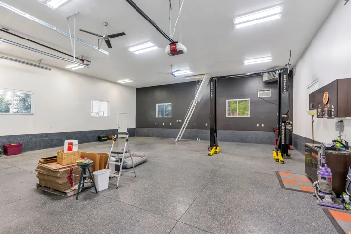 Rare detached garage offers tremendous flexibility for car enthusiasts, with 10,000 lb. car lift included!