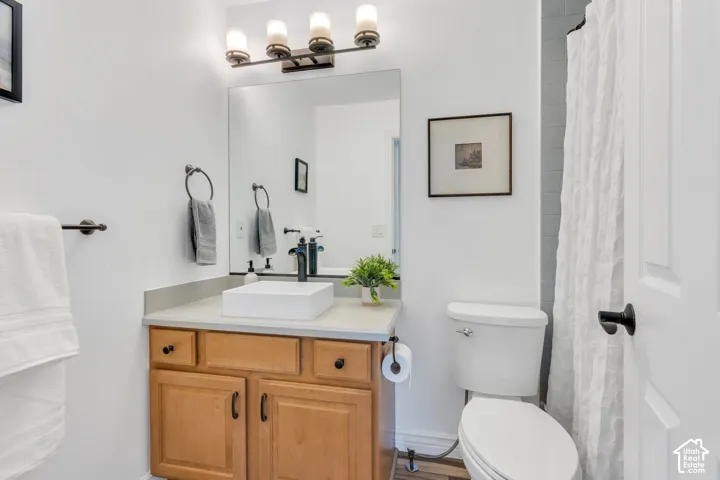 The spacious bedroom above the garage enjoys its own full bathroom, creating a private suite that's ideal for guests, family, or extended stays.