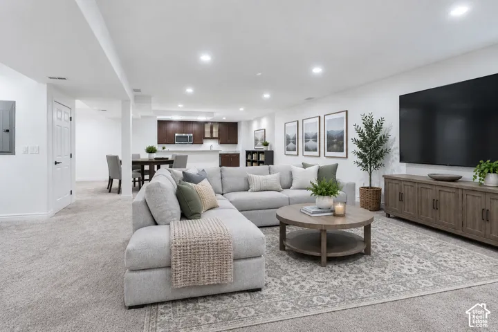 Virtually staged to show the potential for a spacious family and media room.