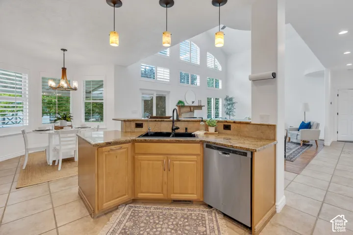Well-designed kitchen opens naturally to the surrounding living spaces.