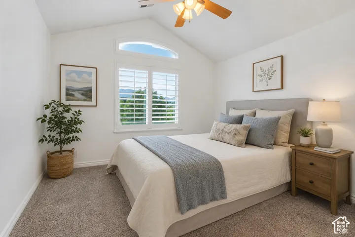 Vaulted ceilings give this upstairs bedroom an open and airy feel.  Enjoy gorgeous views of the Wasatch mountains from the bright window.  Virtually staged to illustrate one possible furniture arrangement and use of the space.