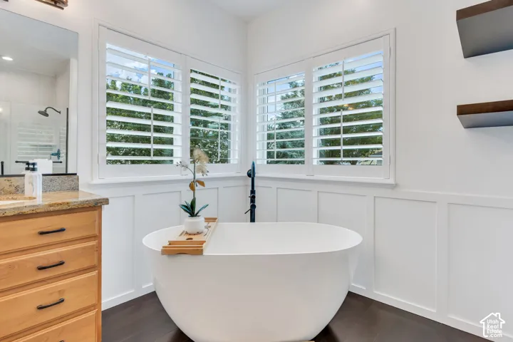 Spacious primary bath with freestanding tub creates a relaxing retreat at the end of the day.