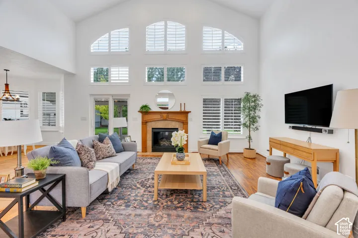 Stunning great room with soaring ceilings, a dramatic wall of windows, and beautiful natural light.