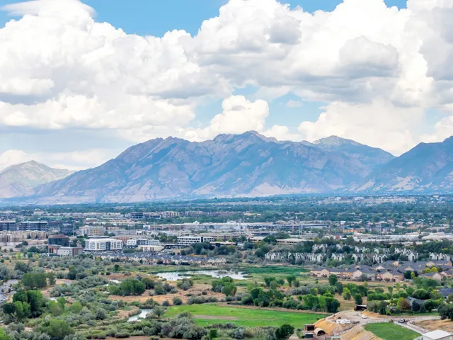 Expansive aerial views highlight the best of Utah living, where beautiful neighborhoods and abundant recreation meet a dramatic mountain backdrop.