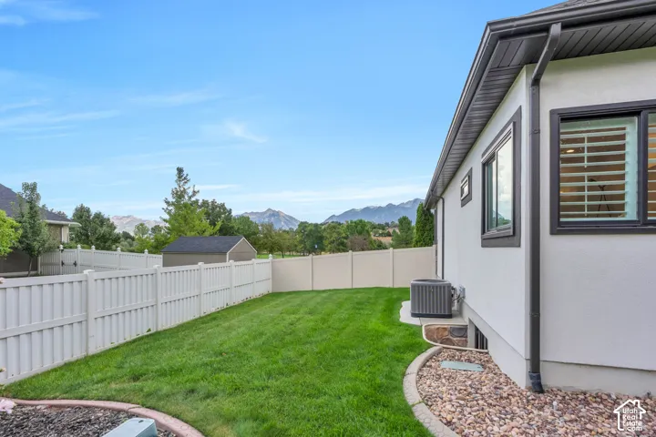 Enjoy privacy and multiple gathering areas in the lush back yard.