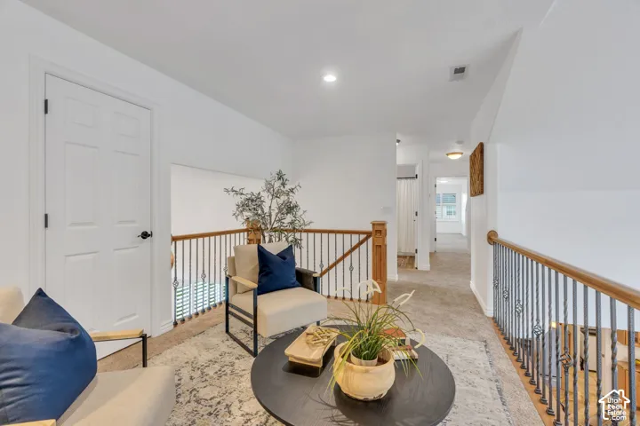 A charming upstairs nook adds flexible living space, perfect for bookshelves, a cozy sitting area, or a peaceful place to unwind.