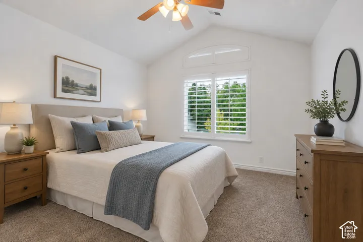 Plantation shutters and abundant natural light add to the appeal of this comfortable 3rd bedroom upstairs.  Virtually staged to illustrate one possible furniture arrangement and use of the space.