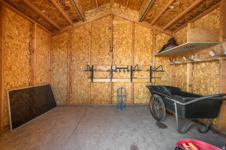 Wood-paneled interior with exposed wood beams