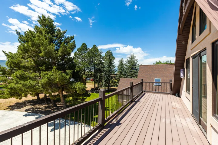 Expansive outdoor deck with composite decking and dark railings
