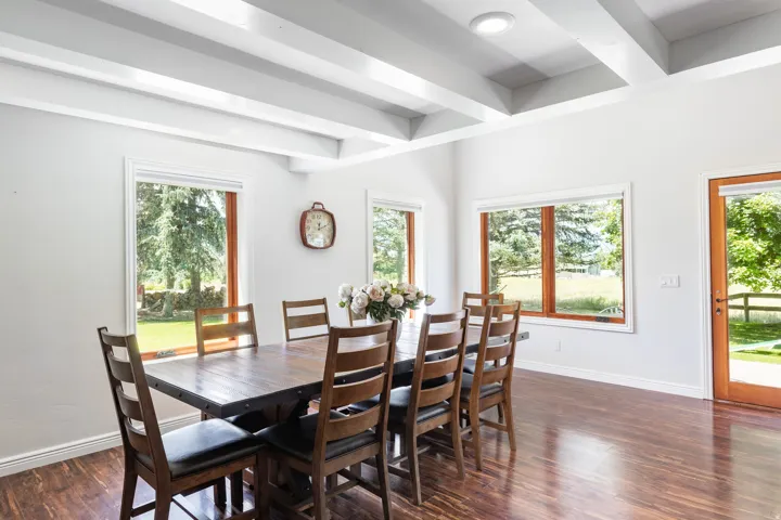 Coffered ceiling with recessed lighting, wood-finish flooring, and multiple wood-framed windows
