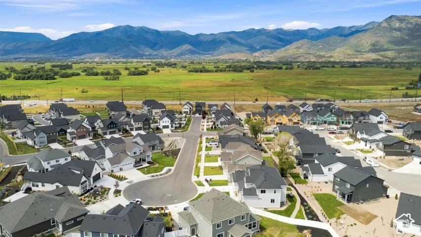 Residential community featuring a variety of home styles, paved streets, and landscaped lots
