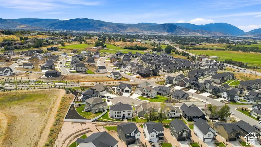 Expansive residential development with mountain backdrops and established roadways