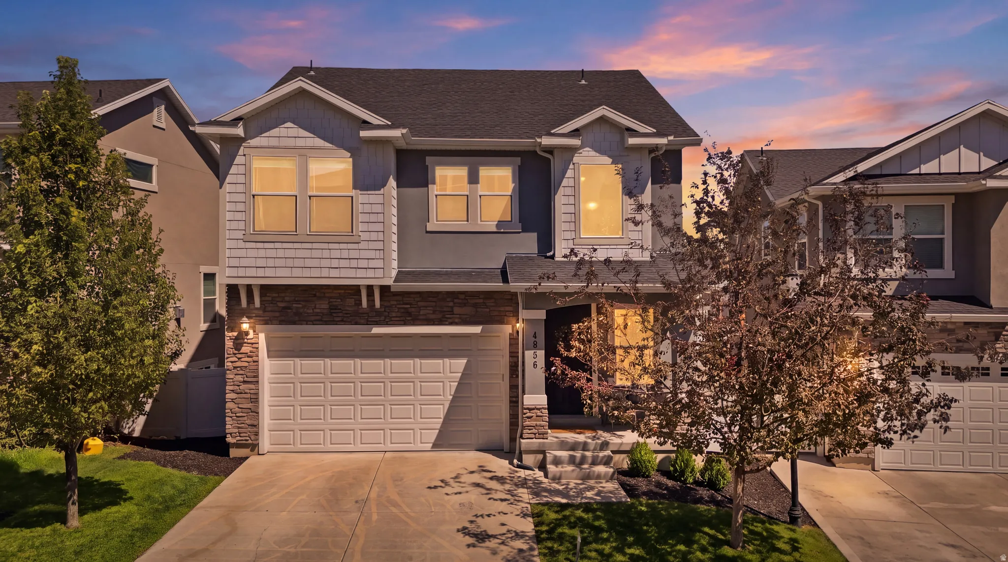 Modern exterior with stone accents and horizontal siding