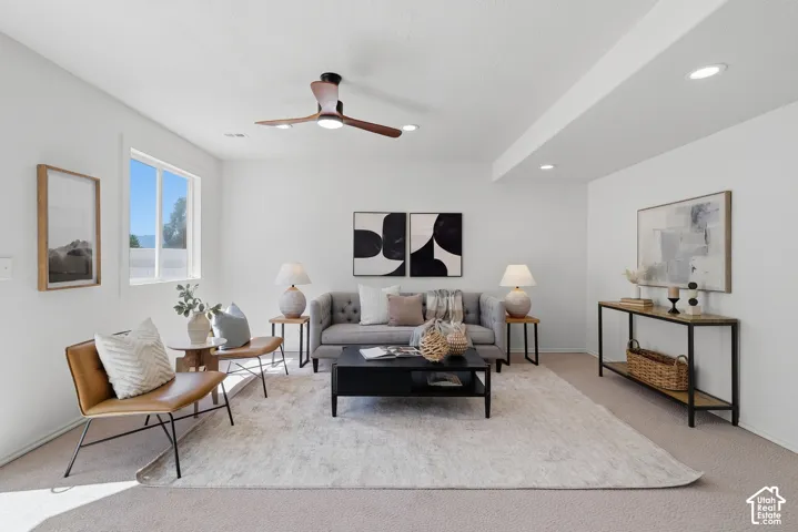 Recessed lighting, wood-finish ceiling fan, and a large window