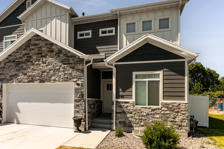 Modern facade with stone veneer and horizontal siding
