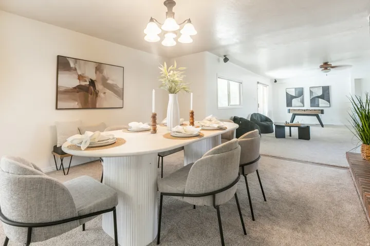 Recessed lighting, ceiling fan, and carpeted flooring throughout
