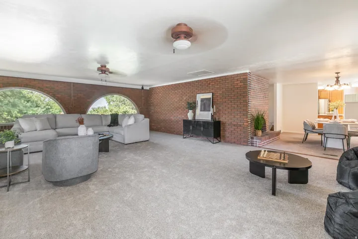 Brick accent wall with a built-in fireplace