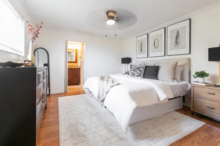 Wood-finish flooring, ceiling fan, and crown molding
