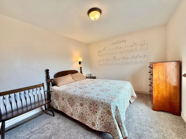 Recessed lighting and wall-mounted sconces illuminate the space