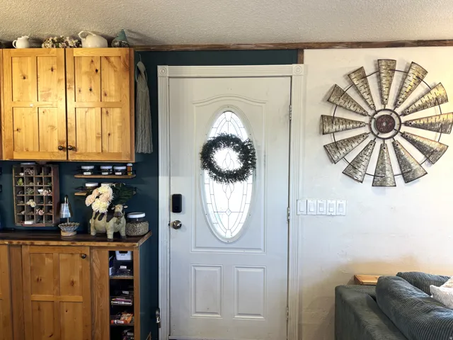 Entry door with an oval-leaded glass insert