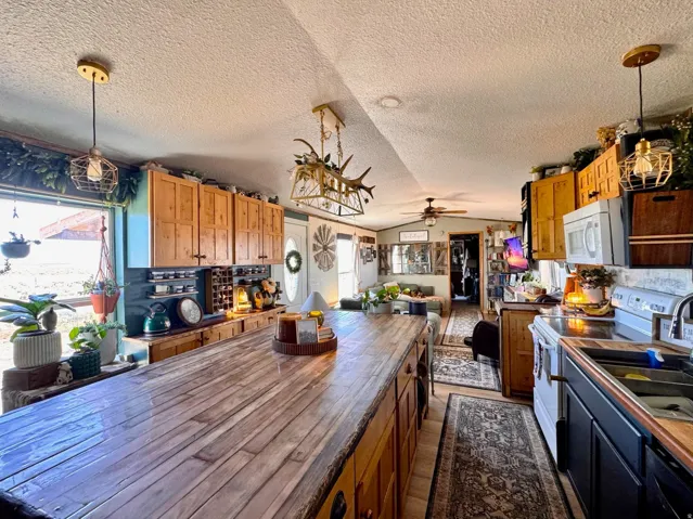 Expansive wood-finish island with seating