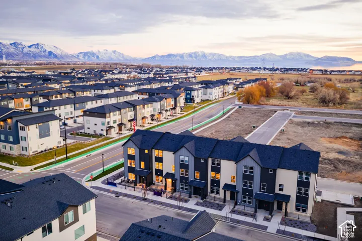Modern townhome community featuring multi-level residences with contrasting exterior finishes