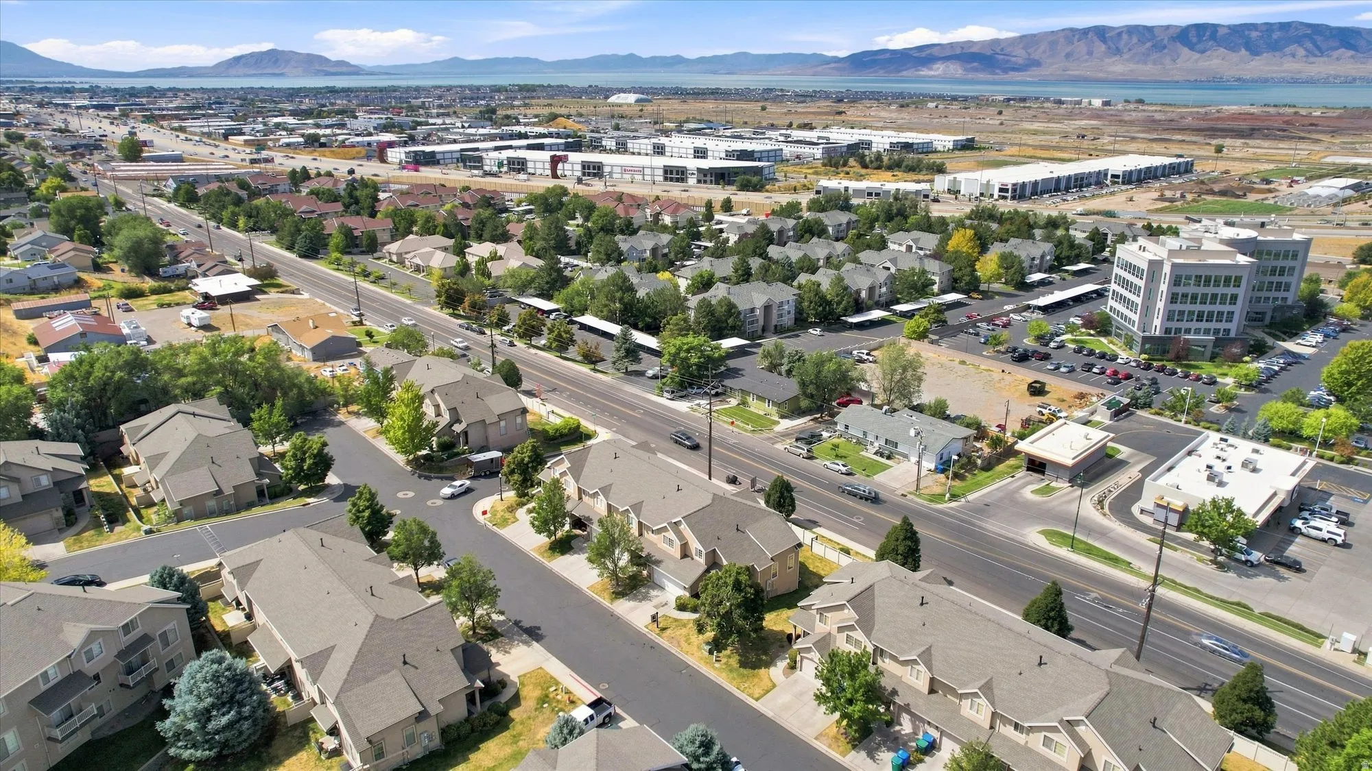 Aerial perspective showcasing a developed neighborhood with various residential and commercial structures